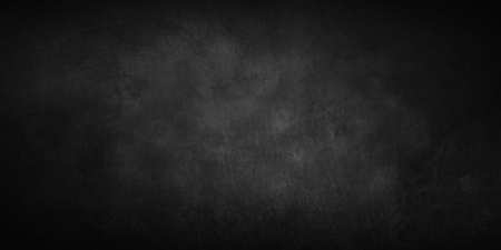 Vintage empty dark background with abstract half-erased old inscriptionsの写真素材