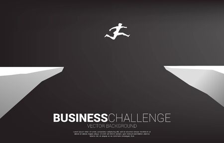 silhouette of businessman jumping over the gap of valley. concept of business challenge risk.のイラスト素材