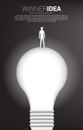 Silhouette of businessman standing on light bulb . Business Concept of creative idea and solution.のイラスト素材