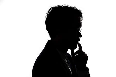 Silhouette of thinking businessman with white background. Concept for business and thinking idea.の写真素材