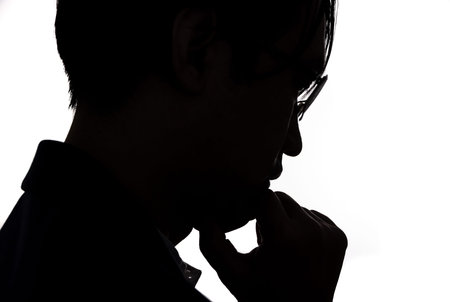 Silhouette of thinking businessman with white background. Concept for business and thinking idea.
