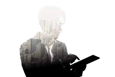 Double Exposure businessman use tablet and skyscraper building city isolate on white background....