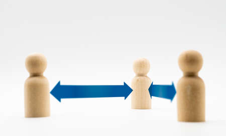 Distance between wooden human icon. Concept of social distancing and isolation.の写真素材