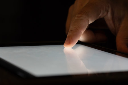 Finger touch on Tablet screen Mock up with light. Concept for mobile phone technology and...