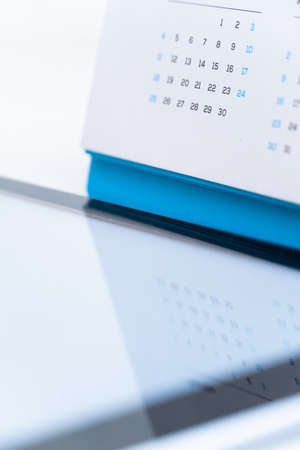 Close up of standy calendar on table. Concept for agenda and planner.の写真素材