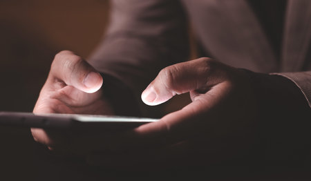 Close up hand of businessman with mobile phone. Concept of technology for business.