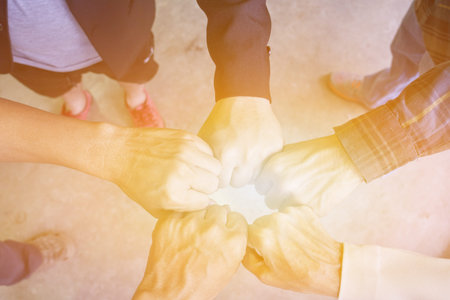 Hands business team showing unity with putting their hands together, Close up of young people...
