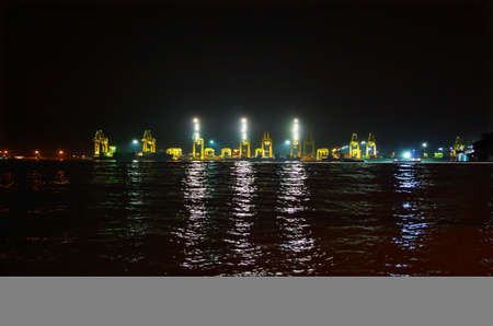 Cranes at Penang seen by night along the river