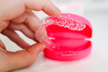 Clear aligners to straighten teeth for adults and teenagers with pink case
