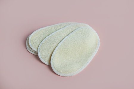 Natural loofah facial sponges offer gentle exfoliation, embodying eco-conscious skincareの写真素材