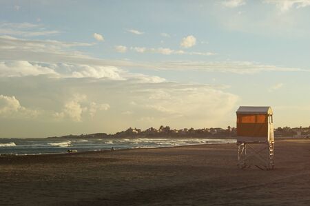 A view of a beach of Mar del Plata alone at sunsetの写真素材