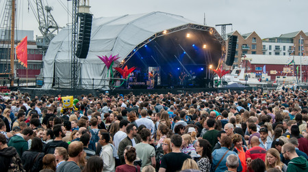Bristol, UK - July 16, 2016: An audience at the Cascade Steps stage shows its appreciation for one of the bands at the annual Harbour Festival in Bristol UKのeditorial素材