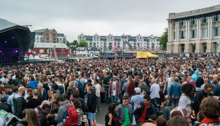 Bristol, UK - July 16, 2016: An audience at the Cascade Steps stage shows its appreciation for one...