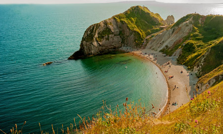 Durdle Door,a very popular beach of sand and fine pebbles on the Jurassic Coast, Dorset, England, United Kingdomの写真素材