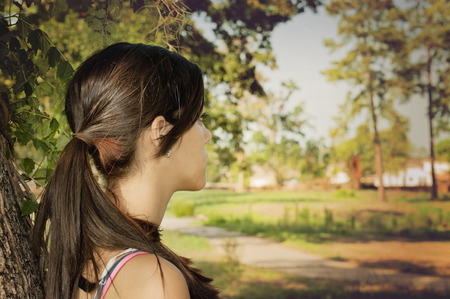 Girl alone thinking in a park in Houston, Texasの写真素材