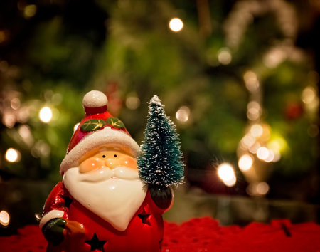 Santa Claus decoration with Christmas tree behind
