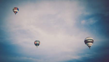 Bristol, UK - August 13, 2016: The Bristol International Balloon Fiesta 2016, showing the mass ascent and landings of over 100 balloons including special shapes and the 'night glow', where the burners are used at night to illuminate the balloons. This annのeditorial素材