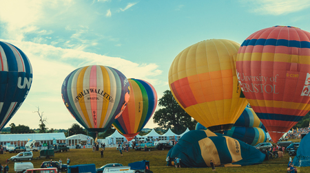 Bristol, UK - August 13, 2016: The Bristol International Balloon Fiesta 2016, showing the mass ascent and landings of over 100 balloons including special shapes and the 'night glow', where the burners are used at night to illuminate the balloons. This annのeditorial素材