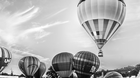 Bristol, UK - August 13, 2016: The Bristol International Balloon Fiesta 2016, showing the mass ascent and landings of over 100 balloons including special shapes and the 'night glow', where the burners are used at night to illuminate the balloons. This annのeditorial素材