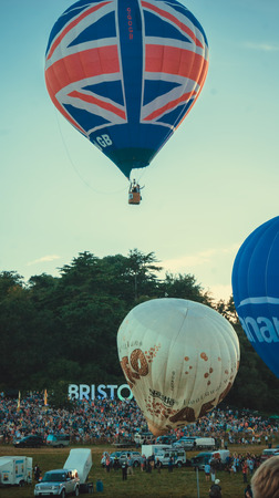 Bristol, UK - August 13, 2016: The Bristol International Balloon Fiesta 2016, showing the mass ascent and landings of over 100 balloons including special shapes and the 'night glow', where the burners are used at night to illuminate the balloons. This annのeditorial素材