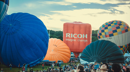 Bristol, UK - August 13, 2016: The Bristol International Balloon Fiesta 2016, showing the mass ascent and landings of over 100 balloons including special shapes and the 'night glow', where the burners are used at night to illuminate the balloons. This annのeditorial素材
