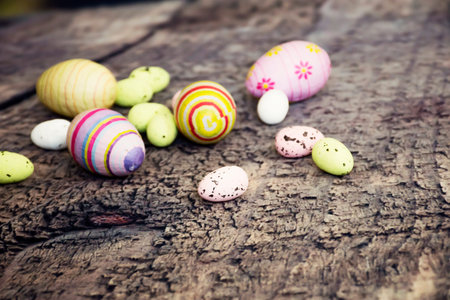 Still life photo of easter eggs on wooden floor