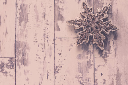 Christmas silver star on a white wooden background with copy-spaceの写真素材
