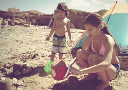 Mar del Plata, Argentina - February 12, 2013:  Argentinian local kids playing on a beach in Mar del PLata, Argentina in a hot summer day.のeditorial素材