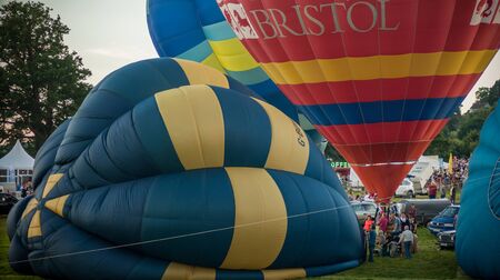 Bristol, UK - August 13, 2016: The Bristol International Balloon Fiesta 2016, showing the mass ascent and landings of over 100 balloons including special shapes and the 'night glow', where the burners are used at night to illuminate the balloons. This annのeditorial素材