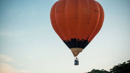 Bristol, UK - August 13, 2016: The Bristol International Balloon Fiesta 2016, showing the mass ascent and landings of over 100 balloons including special shapes and the 'night glow', where the burners are used at night to illuminate the balloons. This annのeditorial素材