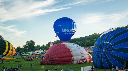 Bristol, UK - August 13, 2016: The Bristol International Balloon Fiesta 2016, showing the mass ascent and landings of over 100 balloons including special shapes and the 'night glow', where the burners are used at night to illuminate the balloons. This annのeditorial素材