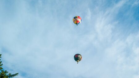 Bristol, UK - August 13, 2016: The Bristol International Balloon Fiesta 2016, showing the mass ascent and landings of over 100 balloons including special shapes and the 'night glow', where the burners are used at night to illuminate the balloons. This annのeditorial素材