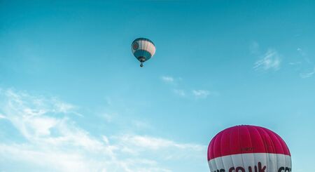 Bristol, UK - August 13, 2016: The Bristol International Balloon Fiesta 2016, showing the mass ascent and landings of over 100 balloons including special shapes and the 'night glow', where the burners are used at night to illuminate the balloons. This annのeditorial素材