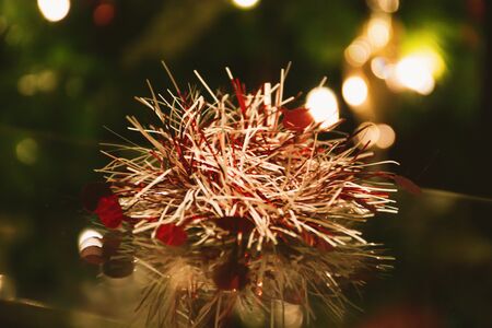 Small red Christmas decoration on a glass table の写真素材