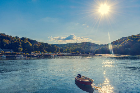 Looe,  Cornwall, England - July 25, 2018: boats moored in the river at looe, cornwall, uk