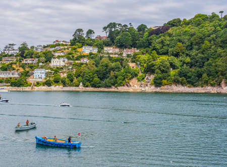 26 July 2018 - Dartmouth, Devon, UK: The Castle Ferry on the River Dart carrying passengers to Dartmouth Castle. The Castle is an artillery fort, built to protect Dartmouth harbour.のeditorial素材