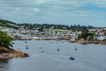 Boats on the river Dart in Dartmouth, South Devon. The town of Kingswear can be seen in the background.の写真素材