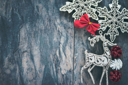 Christmas stars and reno on a wooden background with copy-space