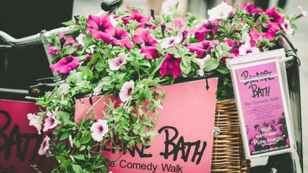 Bath Spa,UK-July 4,  2015: Tandem tricycle used to advertise Bizarre Bath, The Comedy Walk, Bathのeditorial素材