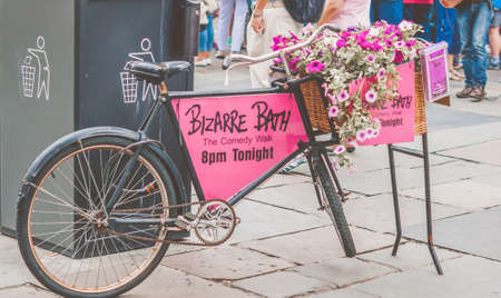 Bath Spa,UK-July 4,  2015: Tandem tricycle used to advertise Bizarre Bath, The Comedy Walk, Bathのeditorial素材