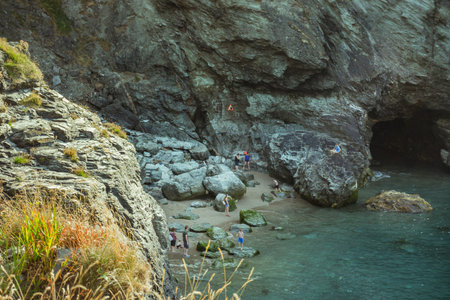 Tintangel, North Cornwall, England - July 24,2018:Merlinâ€™s Cave. Itâ€™s 100 metres long...