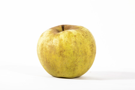 Yellow apple isolated on white backgroundの写真素材