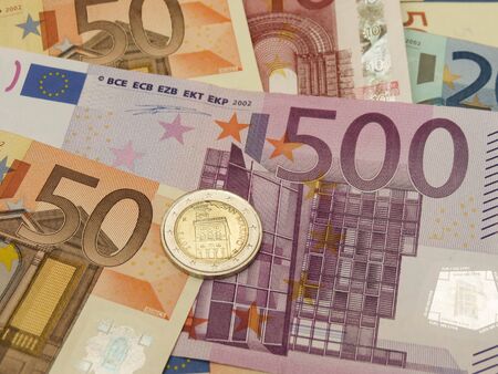 Euro (EUR) banknotes and coins money useful as a background or money concept - with San Marino coinの写真素材