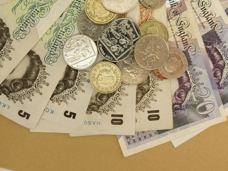 British Sterling Pounds (GBP) banknotes and coins bearing the portrait of Queen Elizabeth IIの写真素材