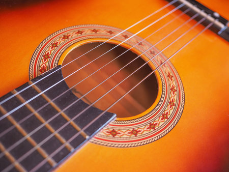 Detail of an acoustic guitar for playing musicの写真素材