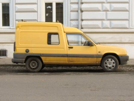 PRAGUE, CZECH REPUBLIC - CIRCA MARCH 2015: Yellow Renault Express Van parked in a street of the city centre.のeditorial素材