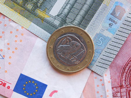 Euro (EUR) banknotes and a one euro coin from Greeceの写真素材