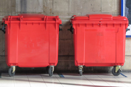 Red waste containers aka Litter bin garbage bin trash bin or waste binの写真素材