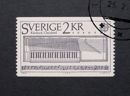 STOCKHOLM, SWEDEN - MAY 23, 2015: A stamp printed by Sweden shows a clavichord stringed keyboard music instrumentのeditorial素材