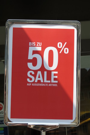 GRAZ, AUSTRIA - CIRCA JULY 2015: "bis zu 50% sale" up to 50% discount label in a fashion shopのeditorial素材